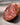 Close-up slice of black truffle salami showing marbled texture and truffle pieces