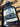 Close-up of blueberry maple syrup label on a glass bottle