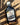 Front view of bourbon barrel aged maple syrup in a glass bottle