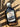 Front view of bourbon barrel aged maple syrup in a glass bottle