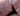 Extreme close-up of raw Wagyu beef showing intense white fat marbling and rich red meat texture.